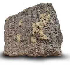 Ett stycke porös sten med mörkgrå och gulaktiga partier. Dess blåbetong utseende ger en känsla av naturlig textur.
